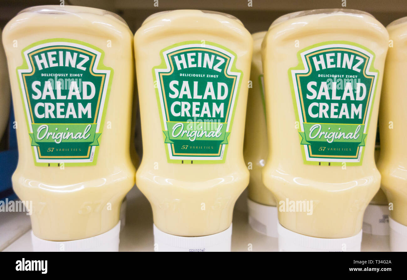 Original Heinz Salad Cream containers on a supermarket shelf in London