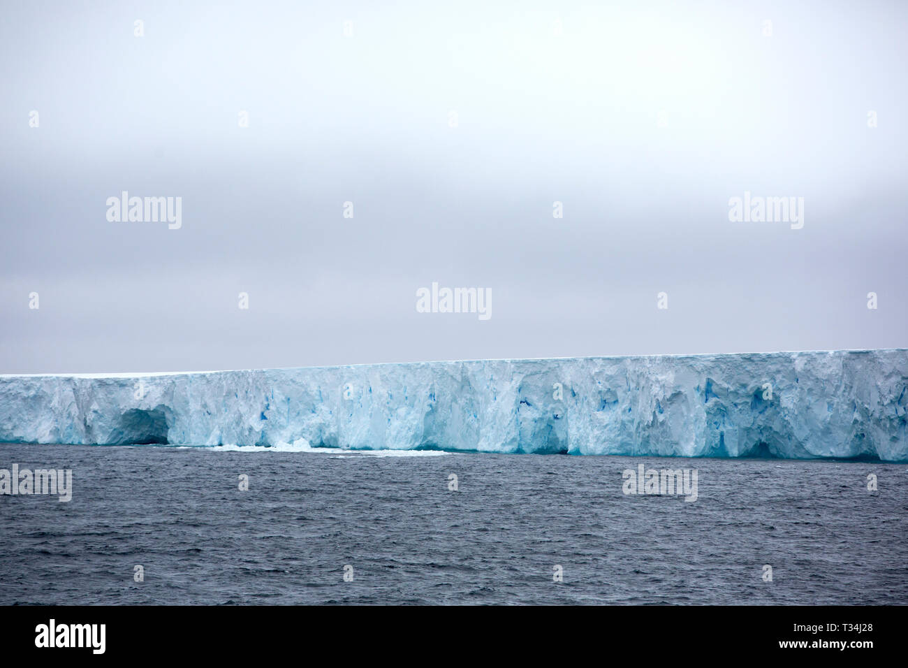 A574 tabular iceberg off the South Shetland Islands in the Bransfield Strait. This named 11 mile long iceburg broke off the Larson C Ice sheet. As cli Stock Photo