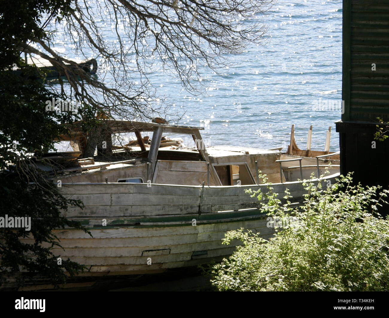 Abandoned Boat on land at Lake Futalaufquen, Chubut, Argentina. Stock Photo