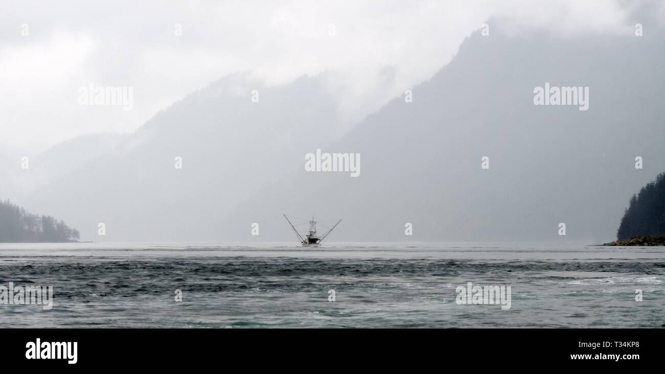 Fishing boat sailing in an inlet, British Columbia, Canada Stock Photo ...