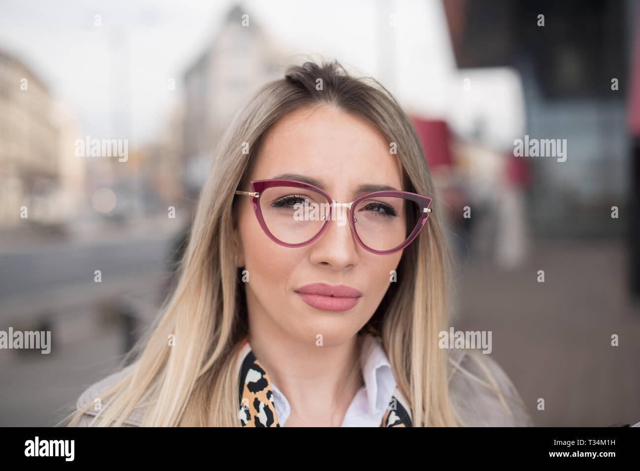 Portrait of a woman standing in the street wearing spectacles, Bosnia and Herzegovina Stock Photo