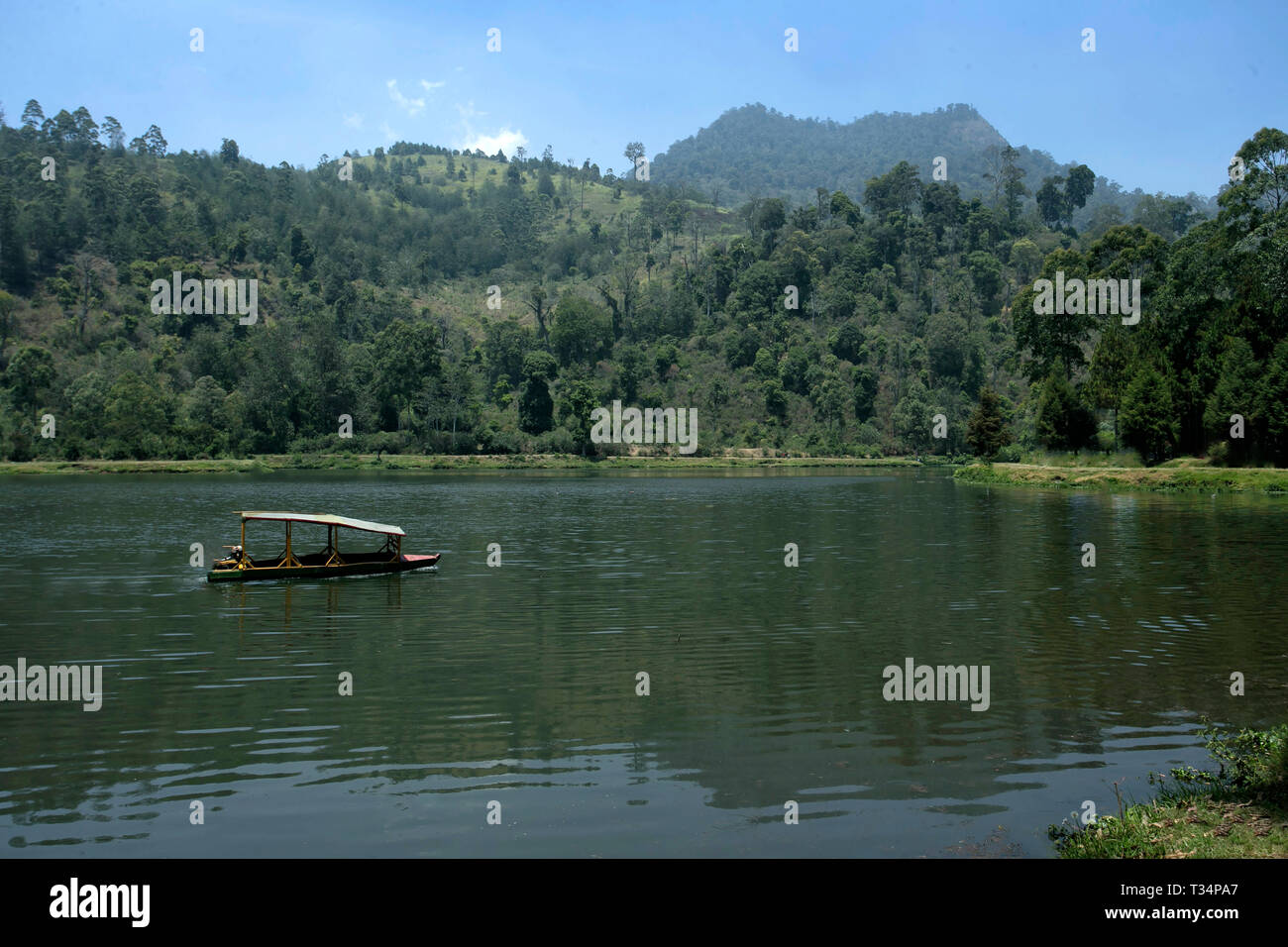 Boat sailing on Pangalengan Lake, West Java, Indonesia Stock Photo