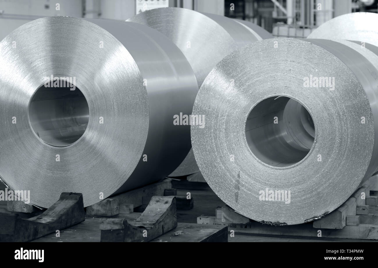 aluminum coils stored waiting for the process just after continuous caster machine. Black and white photo for cover magazine Stock Photo