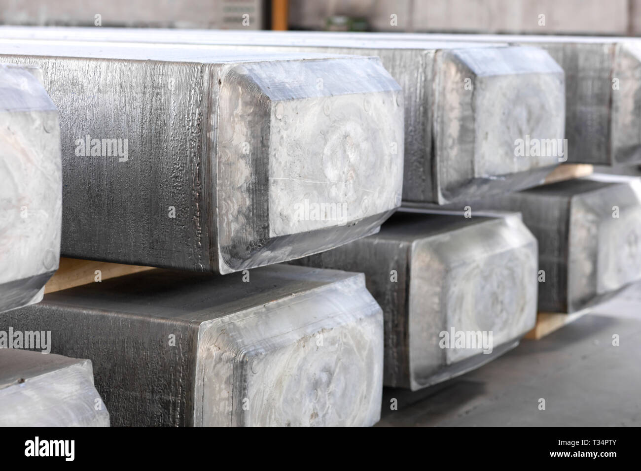 heavy aluminum ingots stacked in a warehouse foundry, raw material to