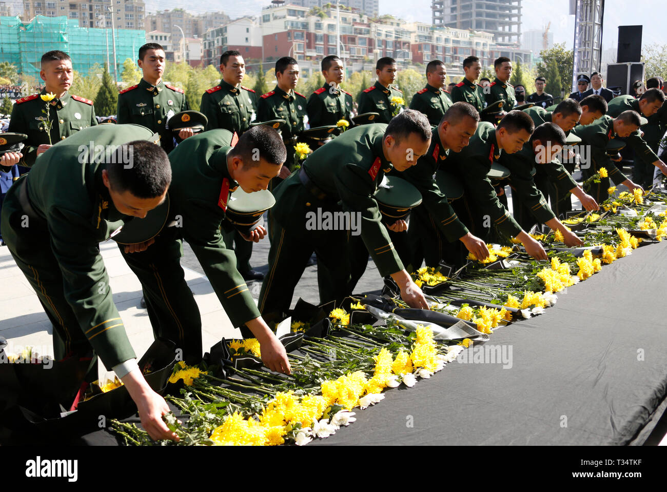 Longnan, China's Gansu Province. 6th Apr, 2019. A ceremony is held to receive the bone ashes of firemen Guo Qi and Wang Fojun, who died while fighting a forest fire in southwest China's Sichuan Province, in Longnan, northwest China's Gansu Province, April 6, 2019. The bone ashes of firemen Guo Qi and Wang Fojun returned to their hometown of Longnan in Gansu Province on Saturday. Credit: Ran Chuangchang/Xinhua/Alamy Live News Stock Photo
