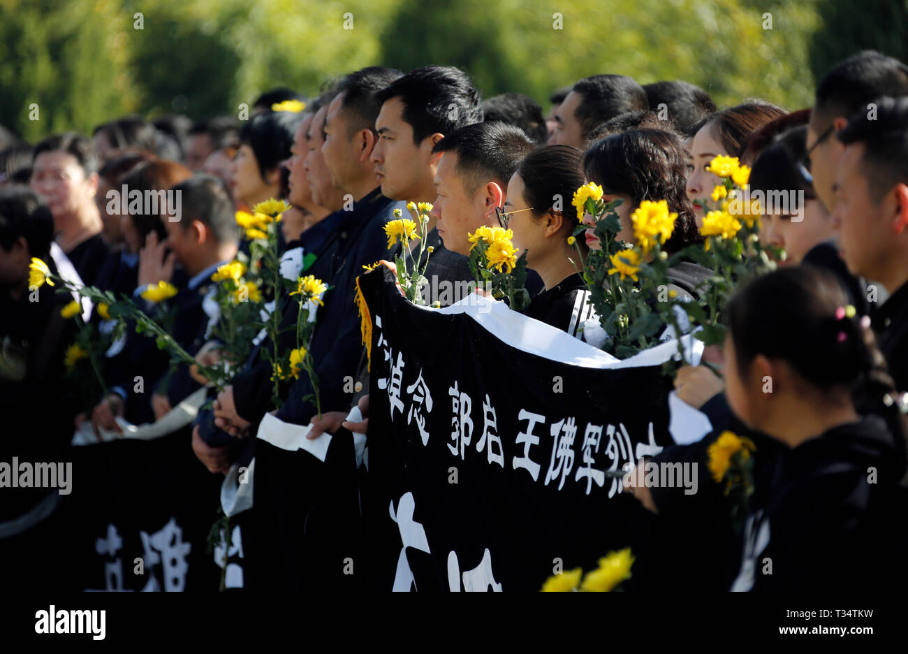 Longnan, China's Gansu Province. 6th Apr, 2019. A ceremony is held to receive the bone ashes of firemen Guo Qi and Wang Fojun, who died while fighting a forest fire in southwest China's Sichuan Province, in Longnan, northwest China's Gansu Province, April 6, 2019. The bone ashes of firemen Guo Qi and Wang Fojun returned to their hometown of Longnan in Gansu Province on Saturday. Credit: Ran Chuangchang/Xinhua/Alamy Live News Stock Photo