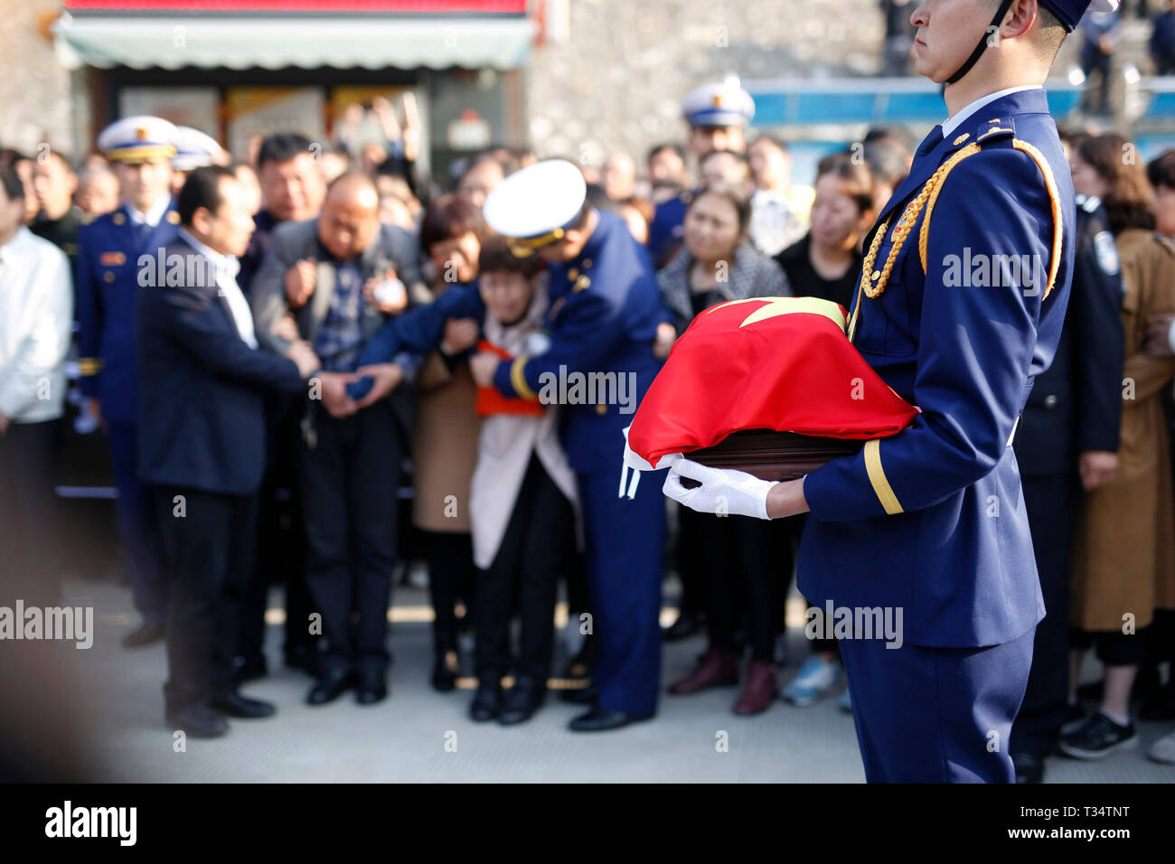 Hanzhong, China's Shaanxi Province. 6th Apr, 2019. A ceremony is held to receive the bone ashes of fireman Gao Jikai, who died while fighting a forest fire in southwest China's Sichuan Province, in Lueyang, northwest China's Shaanxi Province, April 6, 2019. The bone ashes of fireman Gao Jikai returned to his hometown of Lueyang in Shaanxi Province on Saturday. Credit: Wang Wei/Xinhua/Alamy Live News Stock Photo