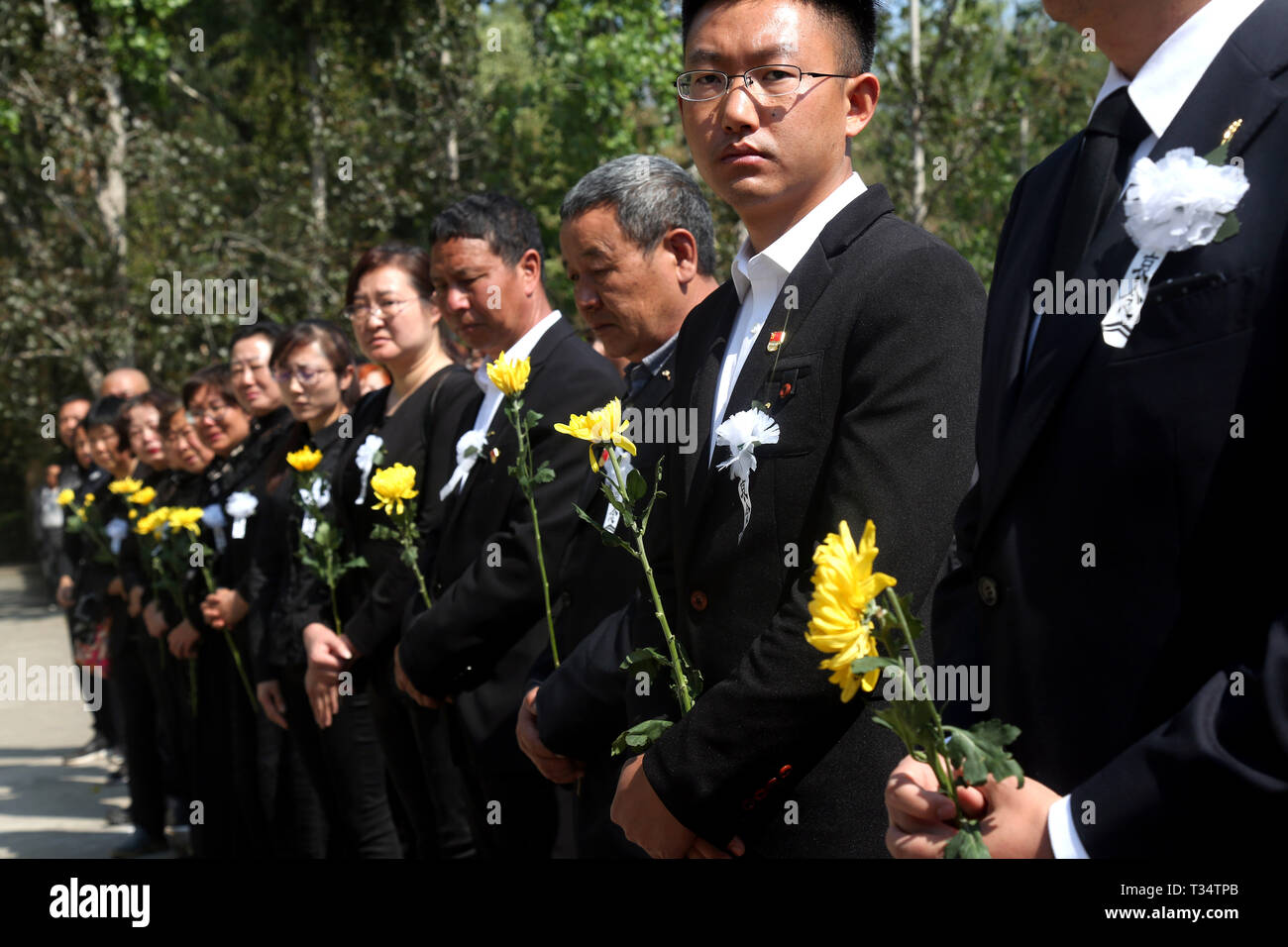 Liangshan, Xichang of Liangshan Yi Autonomous Prefecture in southwest China's Sichuan Province. 6th Apr, 2019. People attend a burial ceremony for the bone ashes of fireman Zhang Hao, who died while fighting a forest fire in Muli, Sichuan Province, at a martyrs' cemetery in Xichang of Liangshan Yi Autonomous Prefecture in southwest China's Sichuan Province, April 6, 2019. Credit: Li Jieyi/Xinhua/Alamy Live News Stock Photo