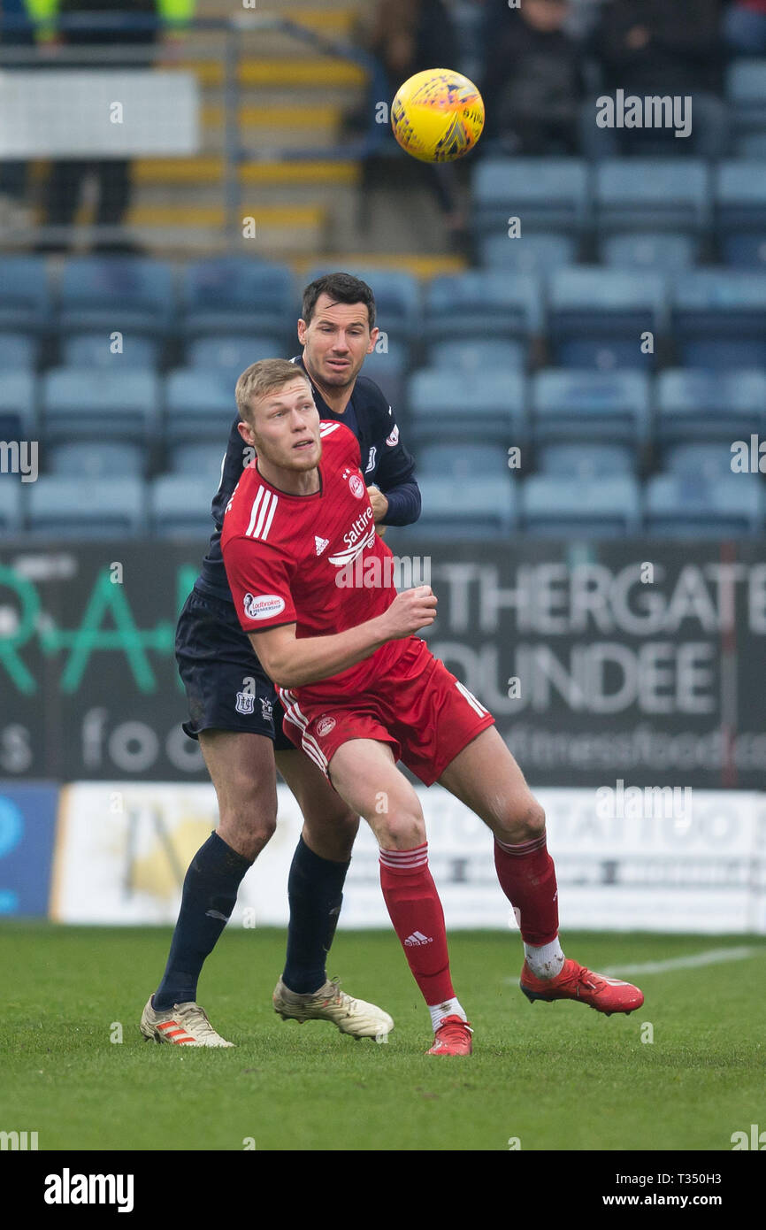 Dens Park, Dundee, UK. 6th Apr, 2019. Ladbrokes Premiership football, Dundee versus Aberdeen; Ryan McGowan of Dundee challenges for the ball with Sam Cosgrove of Aberdeen Credit: Action Plus Sports/Alamy Live News Stock Photo