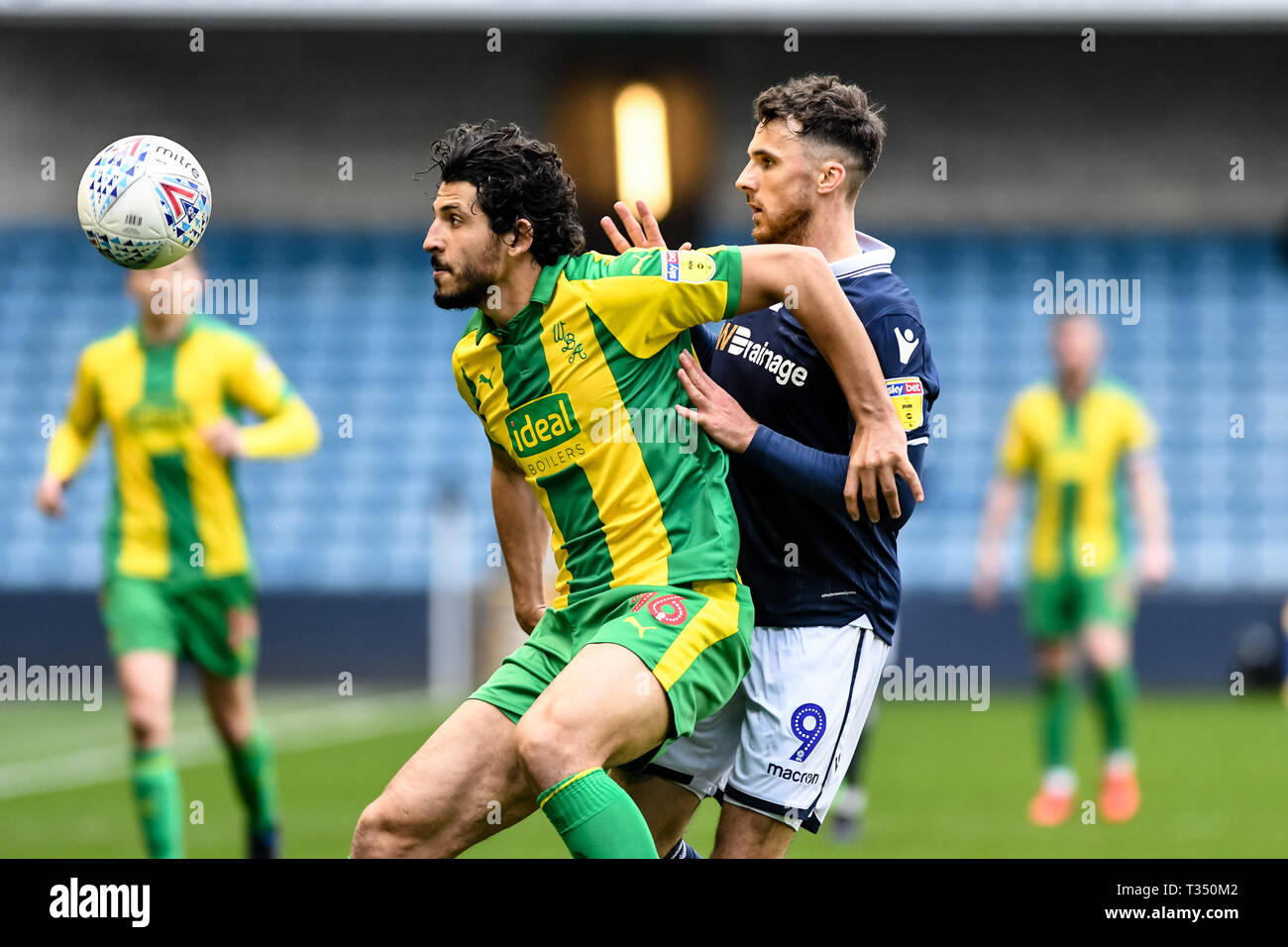 London, UK. 06th Apr, 2019. Ahmed Hegazy of West Bromwich Albion and Lee Gregory of Millwall during the EFL Sky Bet Championship match between Millwall and West Bromwich Albion at The Den, London, England on 6 April 2019. Photo by Adamo Di Loreto.  Editorial use only, license required for commercial use. No use in betting, games or a single club/league/player publications. Stock Photo