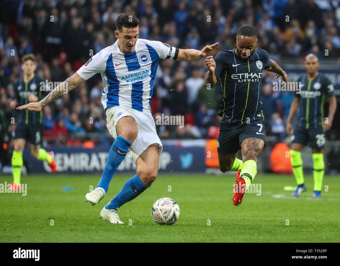 Wembley, London, UK. 06th Apr, 2019.Raheem Sterling of Manchester City and Lewis Dunk of Brighton & Hove Albion during the Emirates FA Cup Semi Final match between Manchester City and Brighton & Hove Albion at WWembley Stadium on April 6th 2019 in London, England. (Photo by John Rainford/phcimages.com) Credit: PHC Images/Alamy Live NewsEditorial use only, license required for commercial use. No use in betting, Stock Photo
