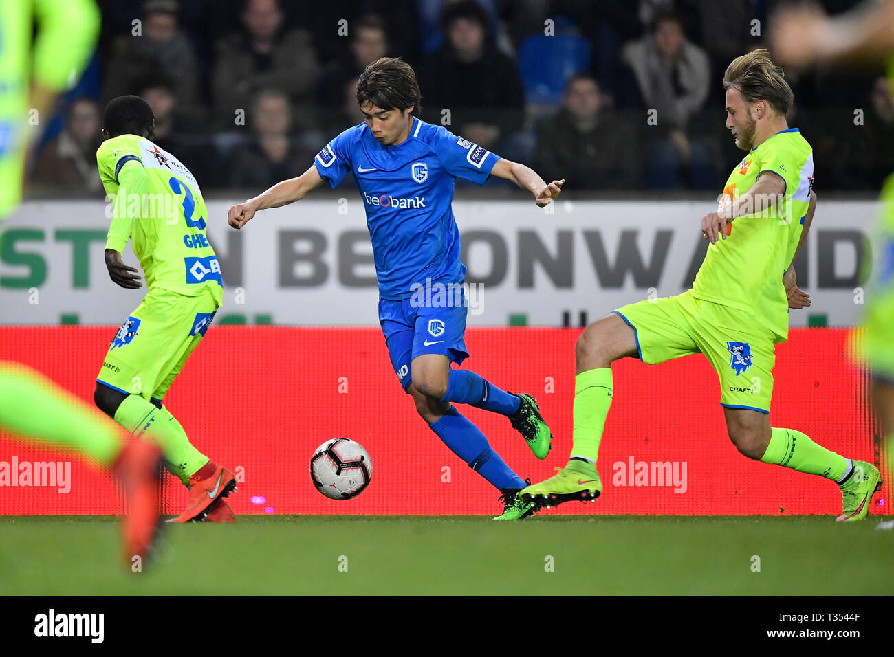 Genk, Belgium. 06th Apr, 2019.    Nana Asare of Kaa Gent, Junya Ito of Genk and Roman Bezus of Kaa Gent fight for the ball during the Jupiler Pro League play-off 1 match (day 3) between Krc Genk and Kaa Gent on April 06, 2019 in Genk, Belgium . ( Photo by Joh Credit: Pro Shots/Alamy Live News Stock Photo