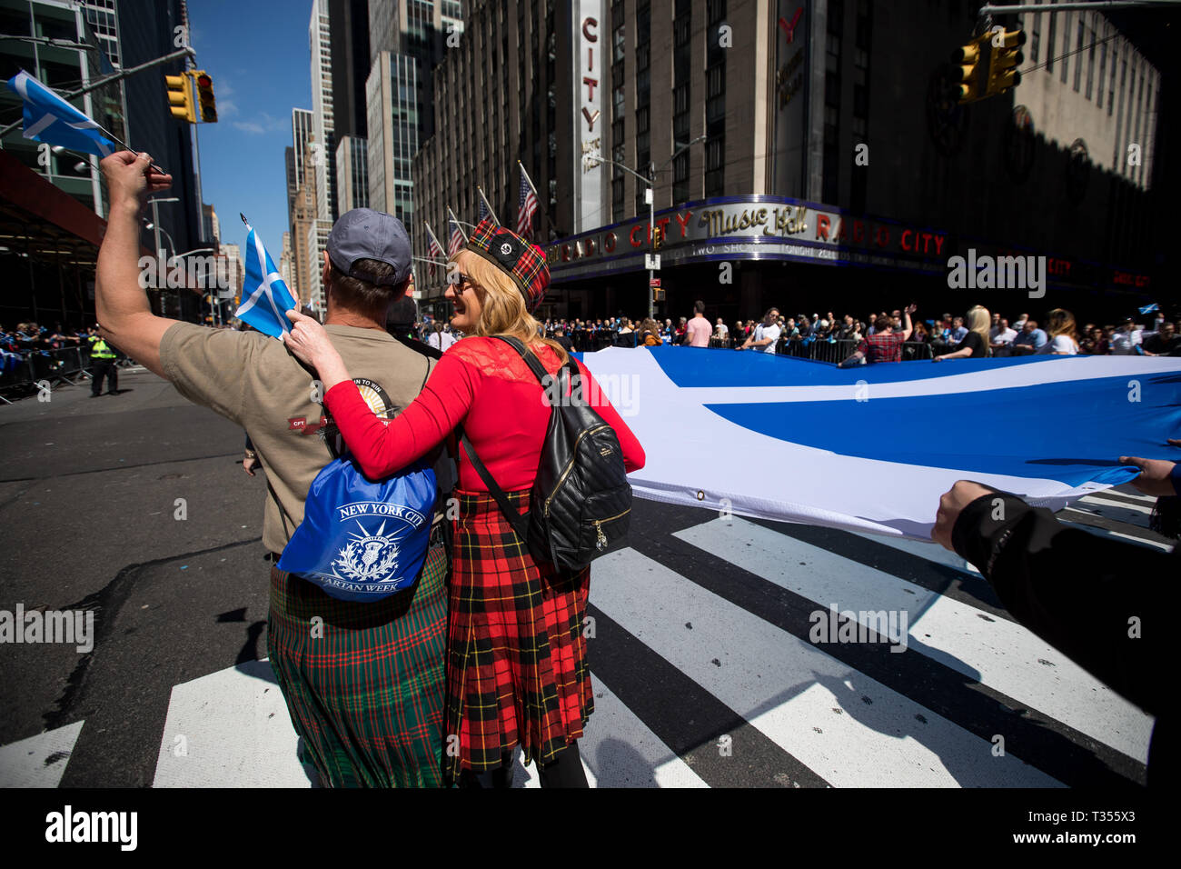 New York, USA. 6th Apr, 2019. Participants carry a giant Scottish flag during the annual Tartan Day Parade in New York, the United States, on April 6, 2019. The parade, which consists of drummers, pipers and dancers, celebrated Scottish and Scottish American heritage. In 1998 the U.S. Senate declared April 6 to be National Tartan Day to recognize the contributions made by Scottish Americans to the United States. Credit: Michael Nagle/Xinhua/Alamy Live News Stock Photo