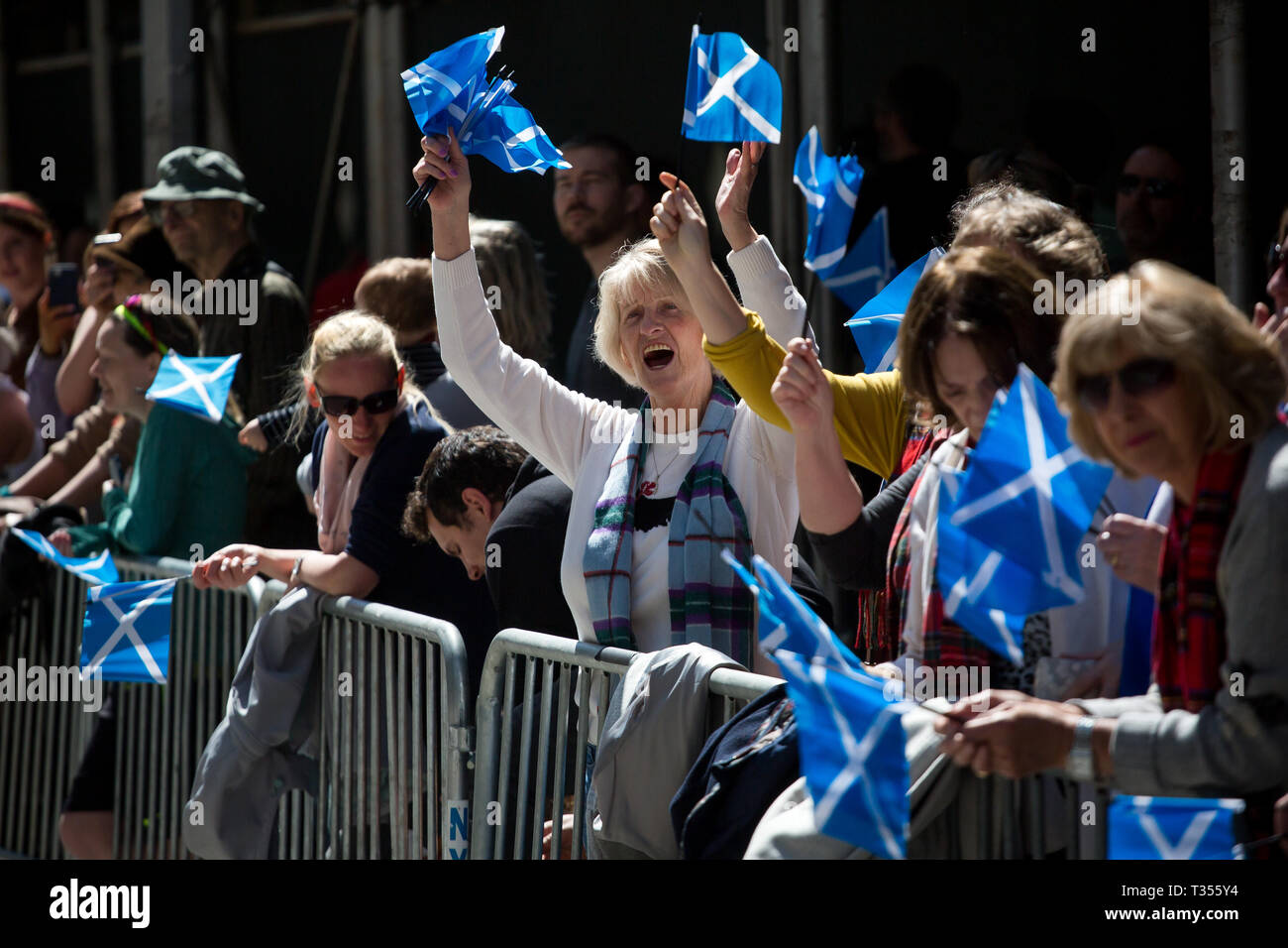 New York, USA. 6th Apr, 2019. People wave Scottish flags during the annual Tartan Day Parade in New York, the United States, on April 6, 2019. The parade, which consists of drummers, pipers and dancers, celebrated Scottish and Scottish American heritage. In 1998 the U.S. Senate declared April 6 to be National Tartan Day to recognize the contributions made by Scottish Americans to the United States. Credit: Michael Nagle/Xinhua/Alamy Live News Stock Photo