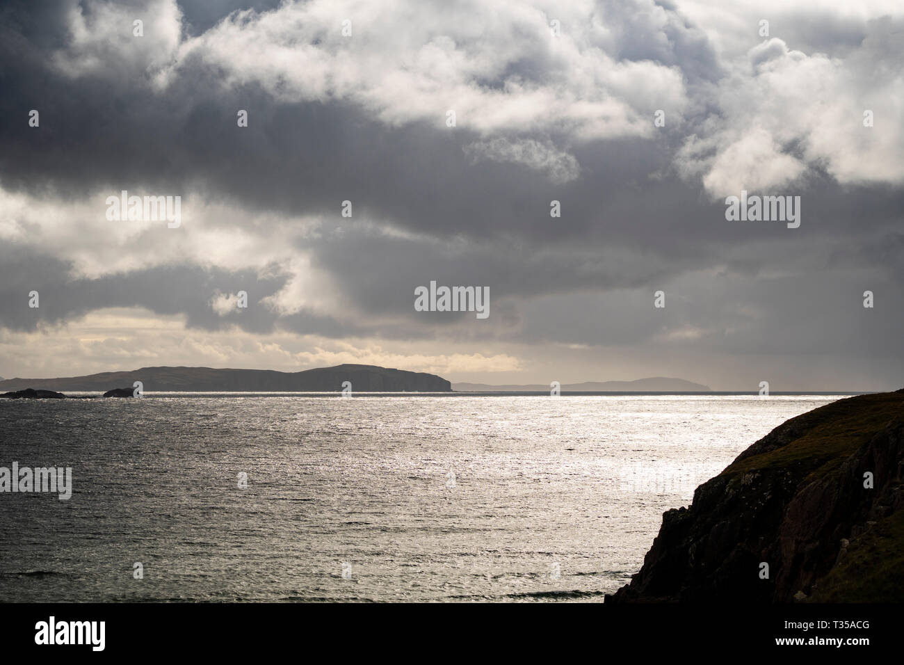 Looking south from Blairmore on an overcast day towards Handa Island and the Old Man of Stoer in Sutherland, Scotland. Stock Photo