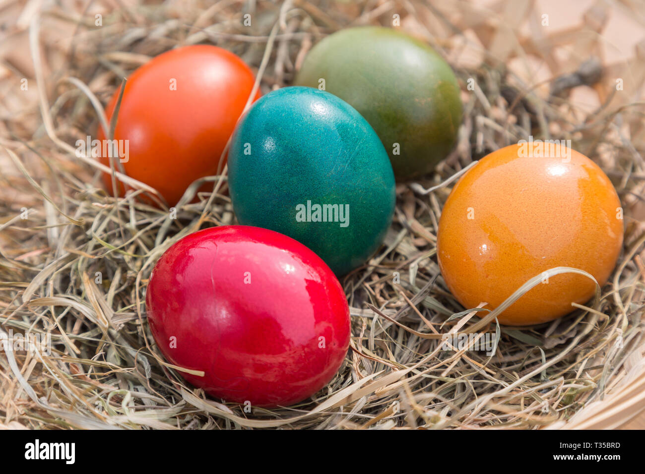 painted easter eggs in a basket Stock Photo