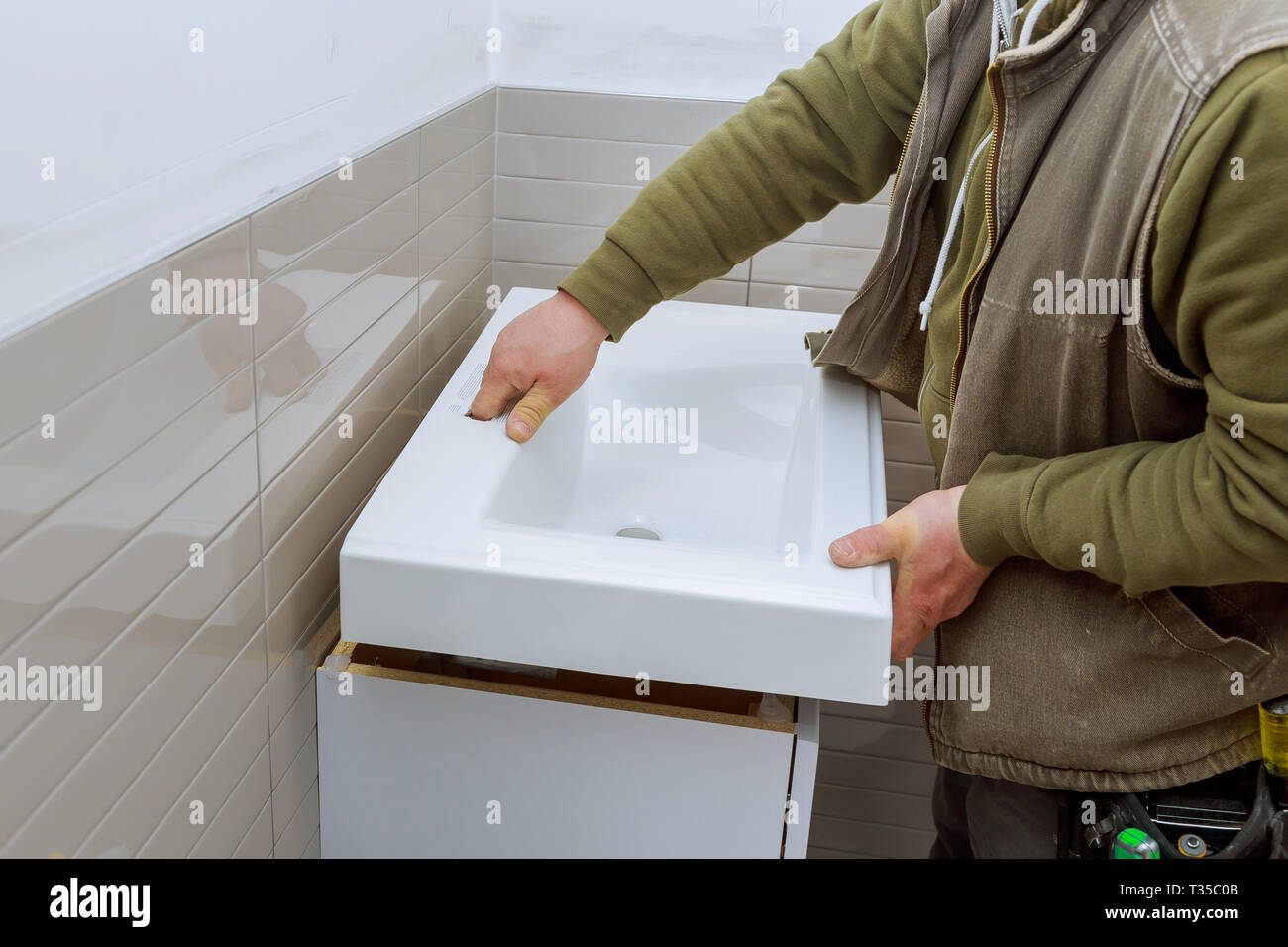 modern bathroom with sanitary installations counter tap bathroom vanity cabinets Stock Photo