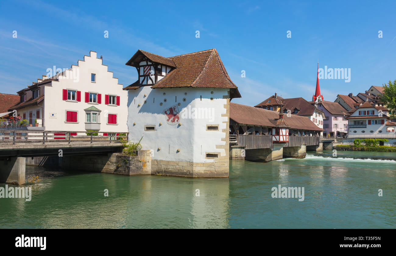 Bremgarten, Switzerland - June 16, 2018: medieval covered bridge over the Reuss river (German: Reussbrucke Bremgarten), buildings of the historic part Stock Photo