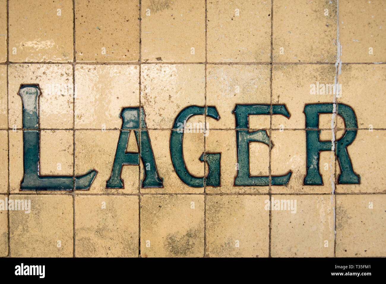 Tiles on the outside of a historic hotel (Pub) or bar in Surry Hills, Sydney, Australia, advertise the type of beer available, Lager Stock Photo