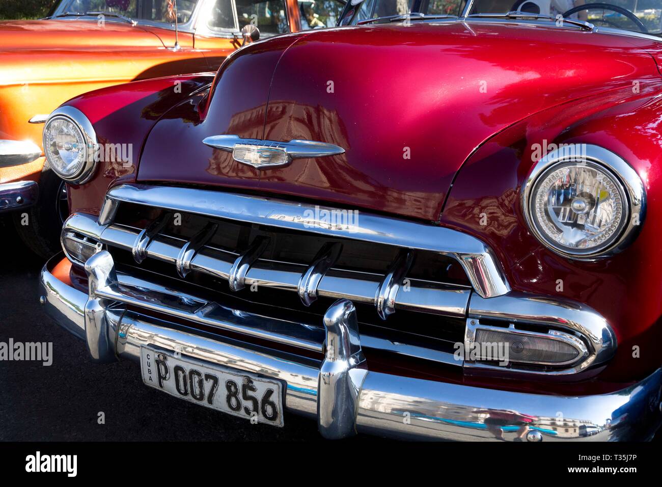 Red 1952 Chevy Convertible parked on Cuba Tacon in Havana, Cuba Stock Photo