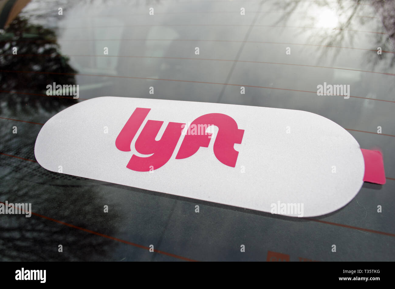 Lyft sticker close up on windshield glass of Lyft drivers