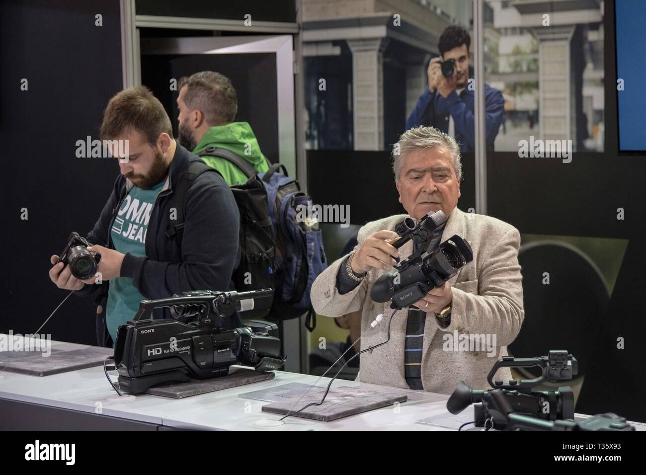 People are seen looking at the new cameras during the festival. Image +Tech & Photo vision 2019 is a big festival with large corporate delegations, many exhibitions, stores and workshops about photography and video was held In the place of Helexpo Marousi in Athens, Greece. Stock Photo