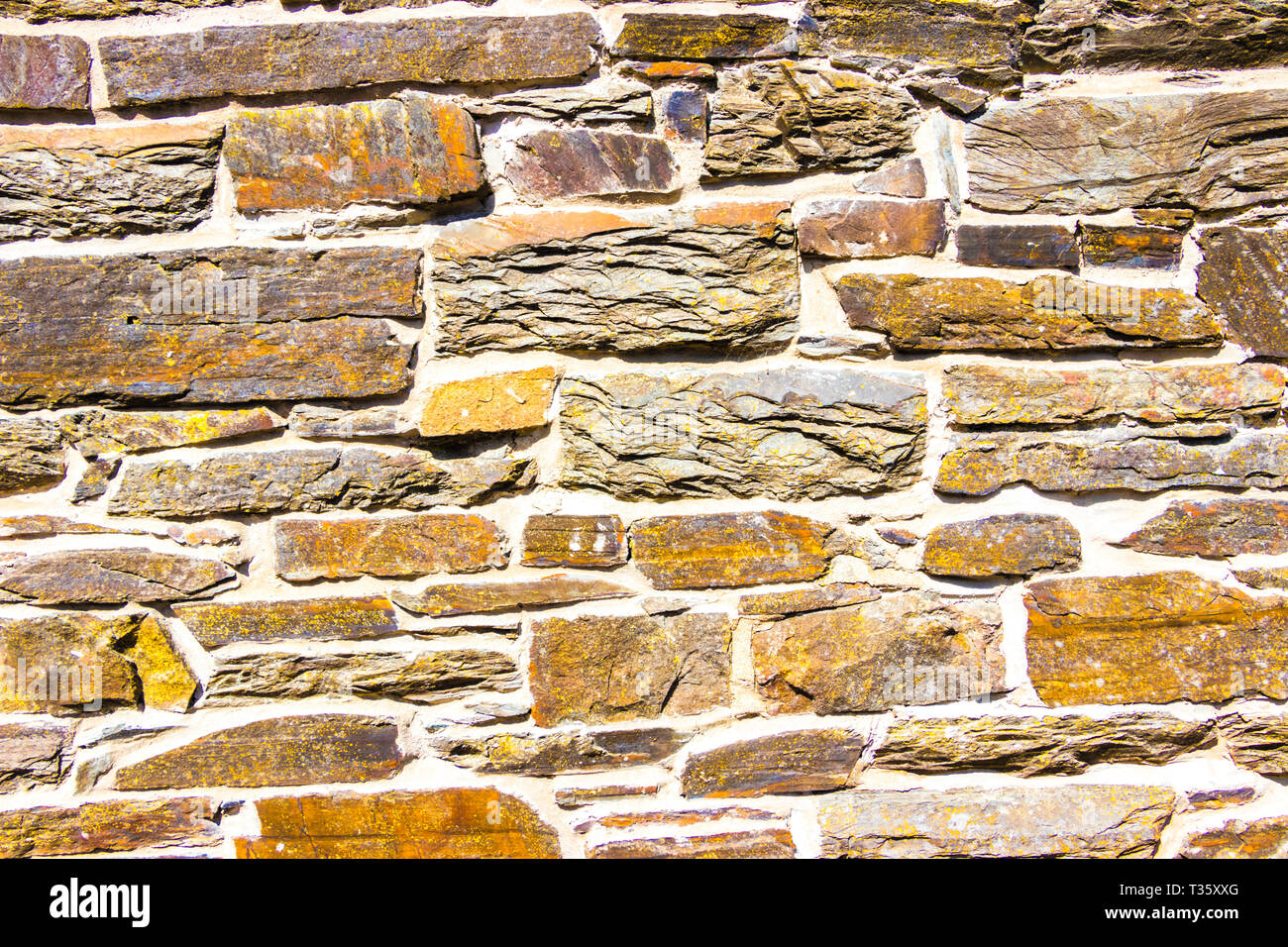Close up of schist & mortar stone wall texture Stock Photo
