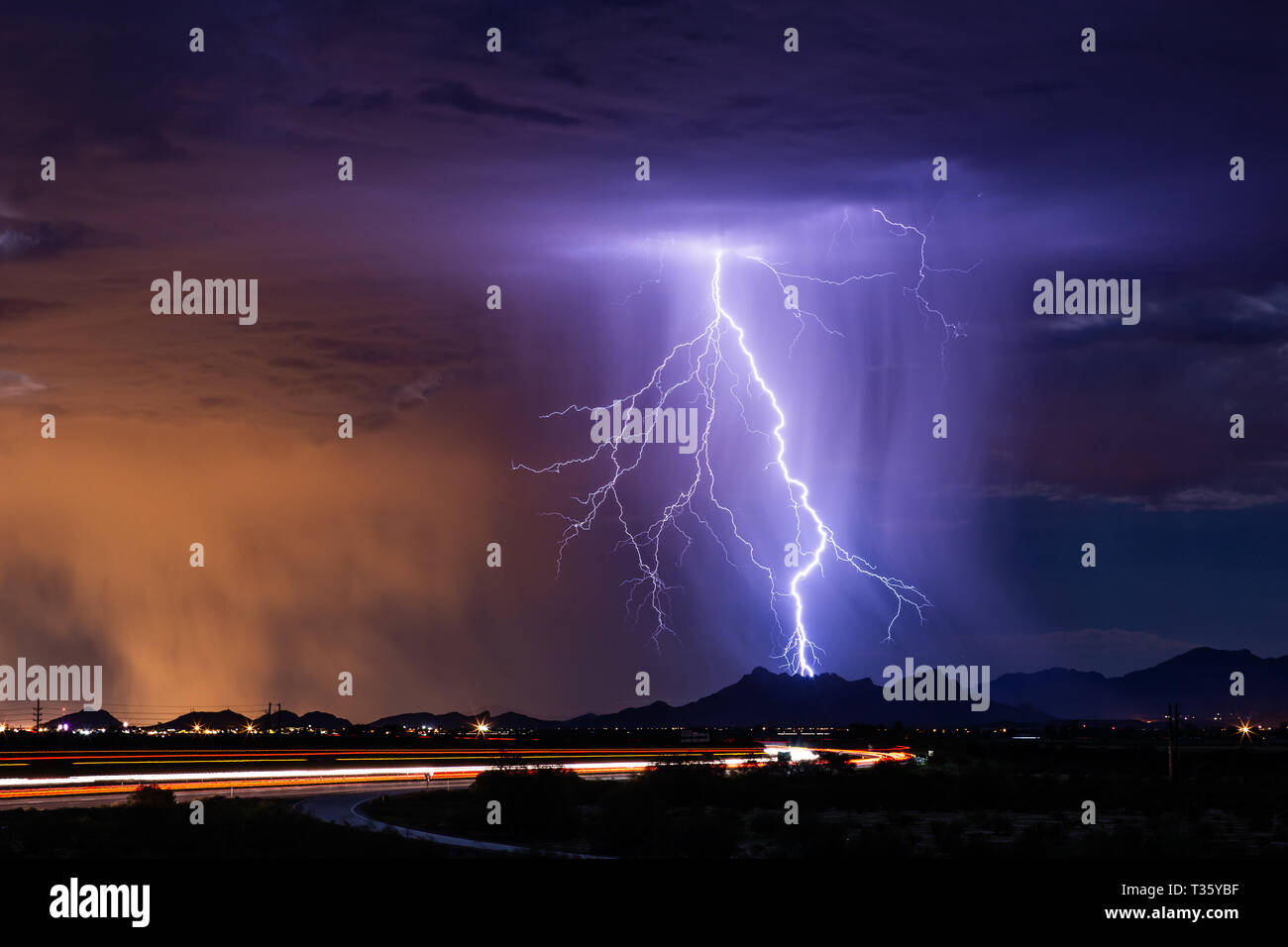 Lightning strikes a mountain as a monsoon thunderstorm moves across