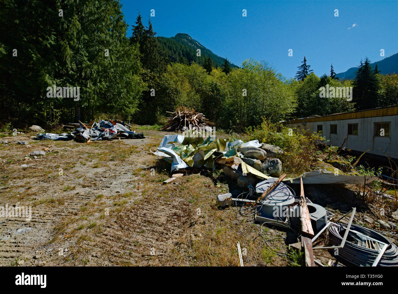 An abandoned logging camp being removed at the north end of Stave Lake in Mission, British Columbia, Canada Stock Photo
