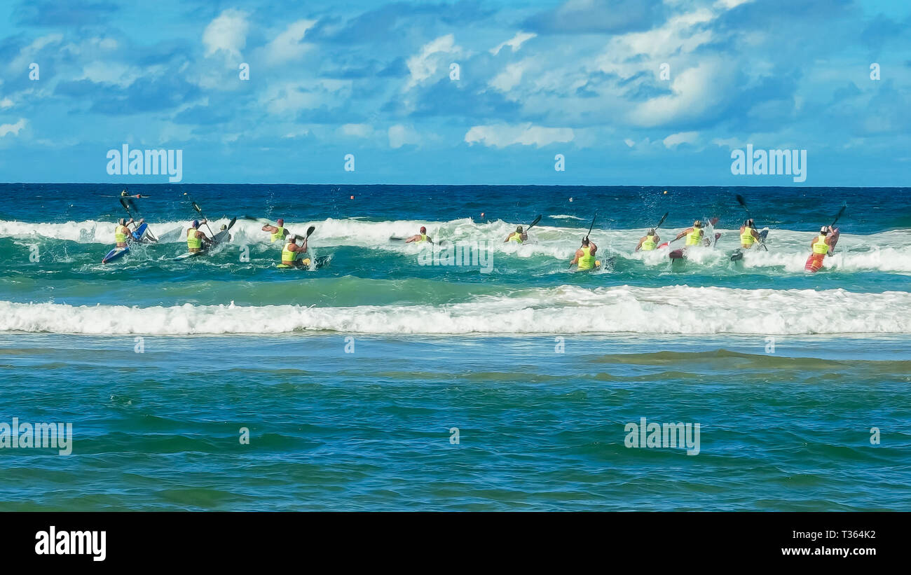 ALEXANDRA HEADLAND, QUEENSLAND, AUSTRALIA- APRIL 24: wide shot of men's surf ski race on the sunshine coast of australia Stock Photo