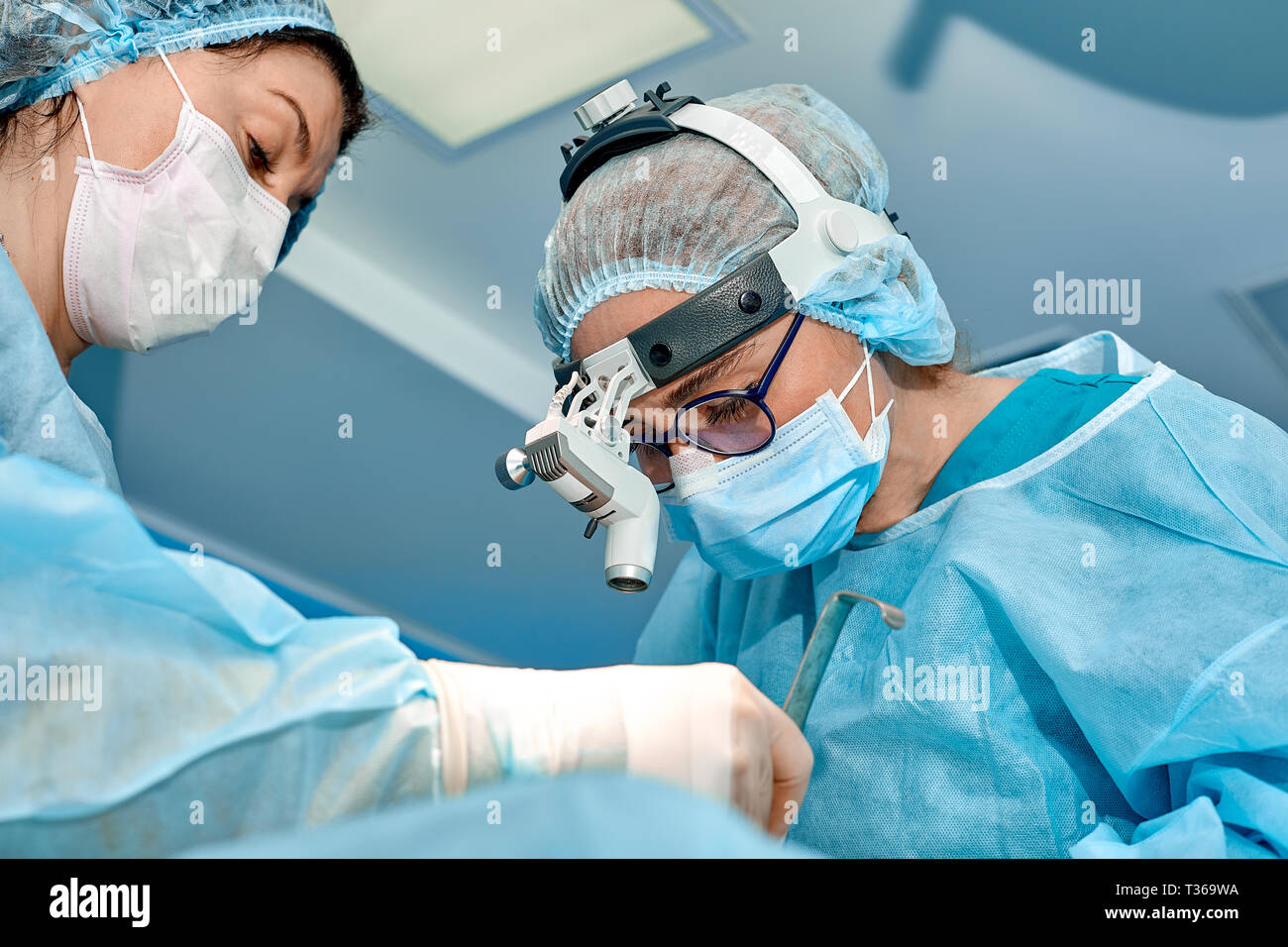 Team of surgeons makes an invasive operation. Portrait of surgeons