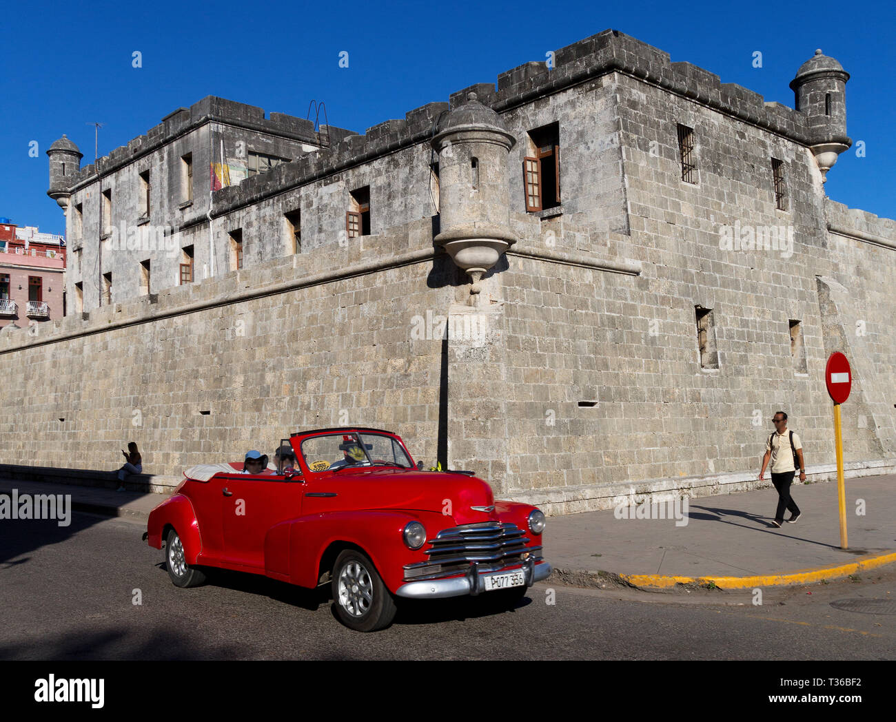 Red 1957 Chevy Convertible Street Rod Cruiser driving the street in Havana, Cuba Stock Photo