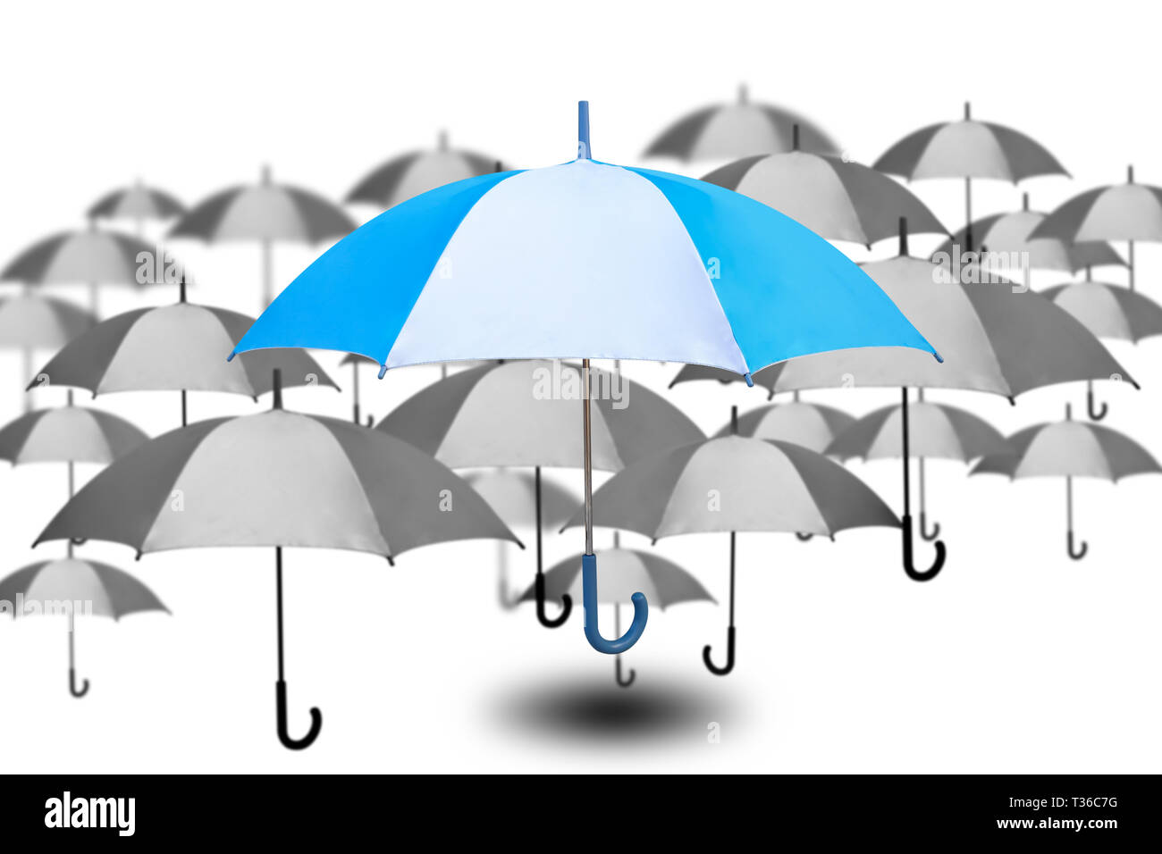 Outstanding umbrella with small umbrella in monochrome color on white