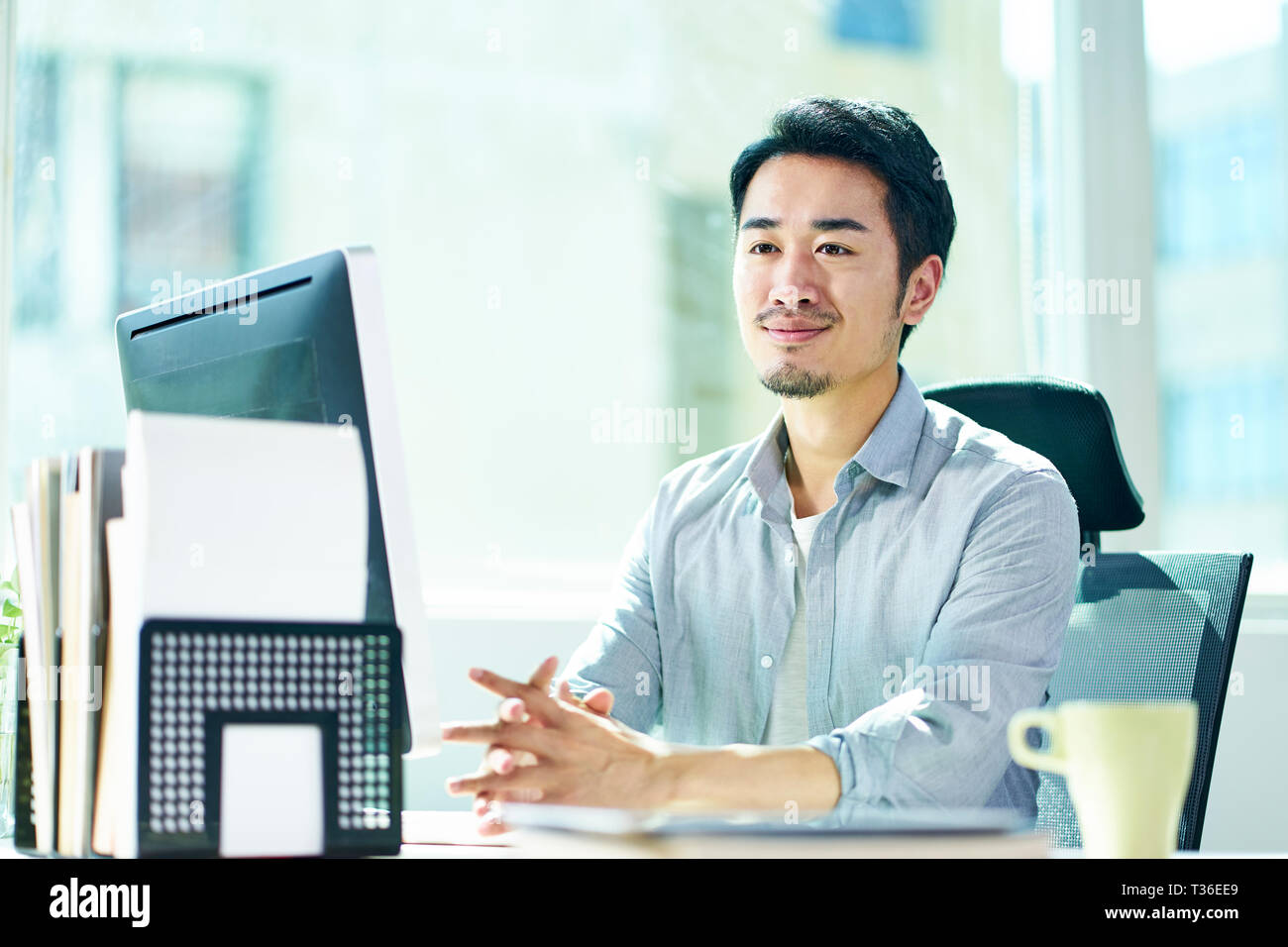 108,708 Man Sitting At Desk Stock Photos, High-Res Pictures, and