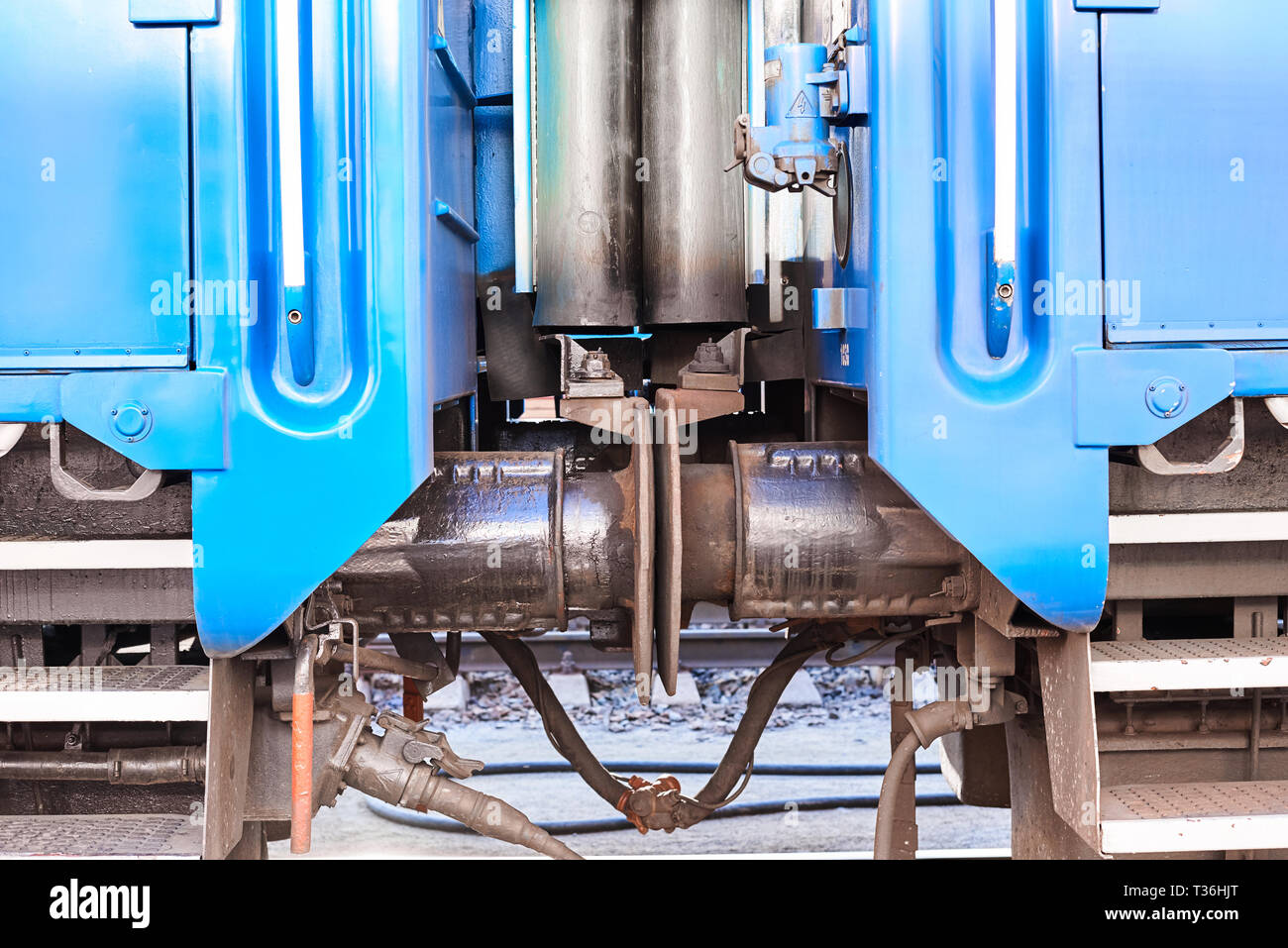 connection between passenger cars train on railway, close up. Buffer