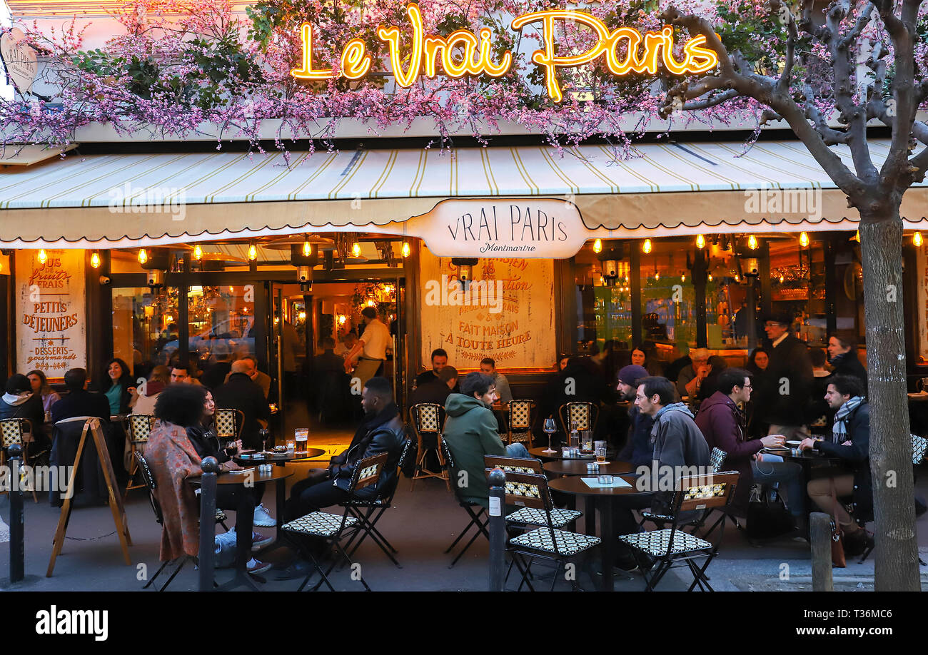 The famous Cafe Le Vrai Paris at night . It is located in the Montmartre, Paris, France. Stock Photo