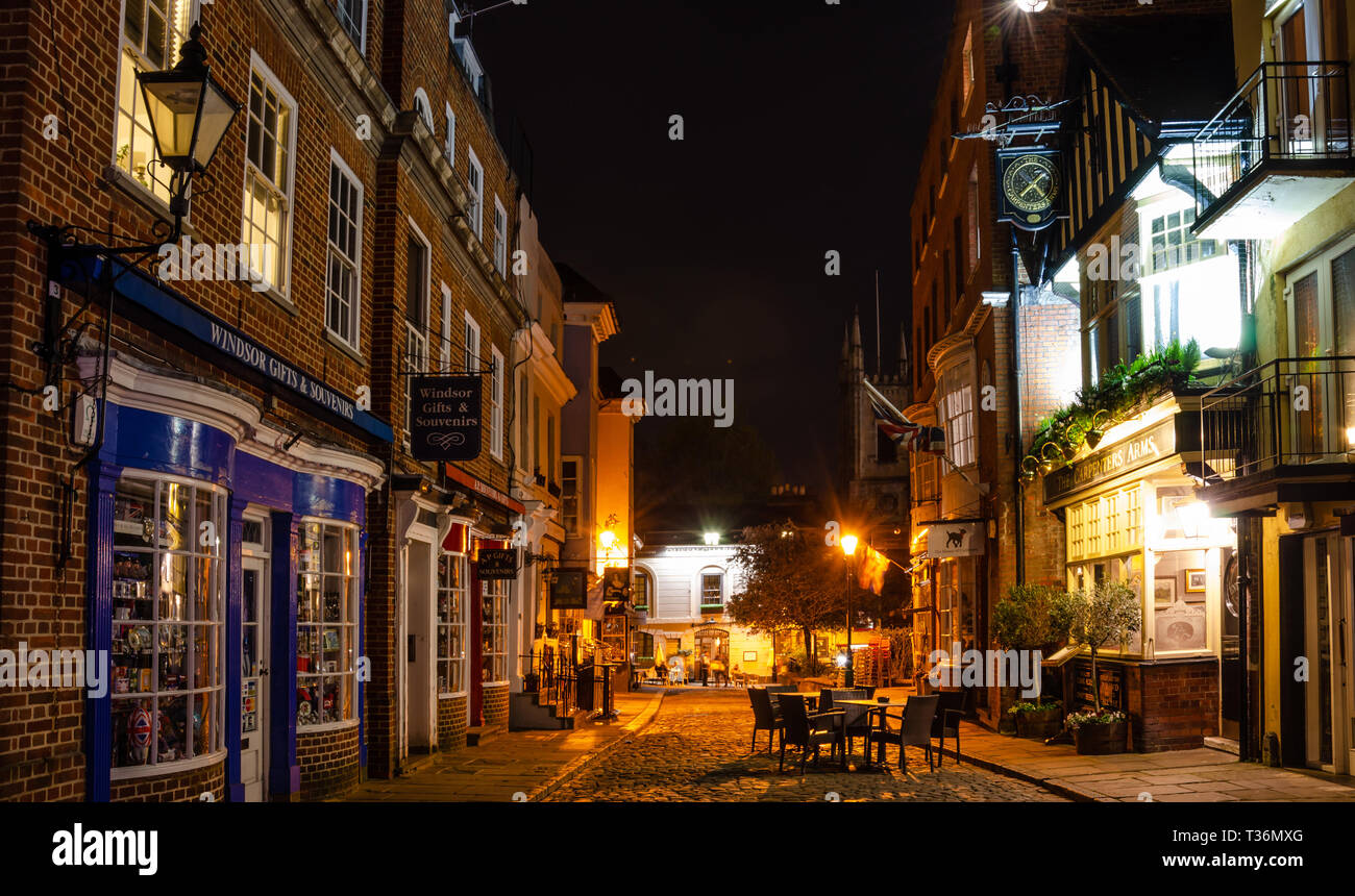 Church Street in Windsor, Berkshire, UK at night. Church Street is a cobbled, pedestrianized street with pubs, restaurants and tourist shops. Stock Photo