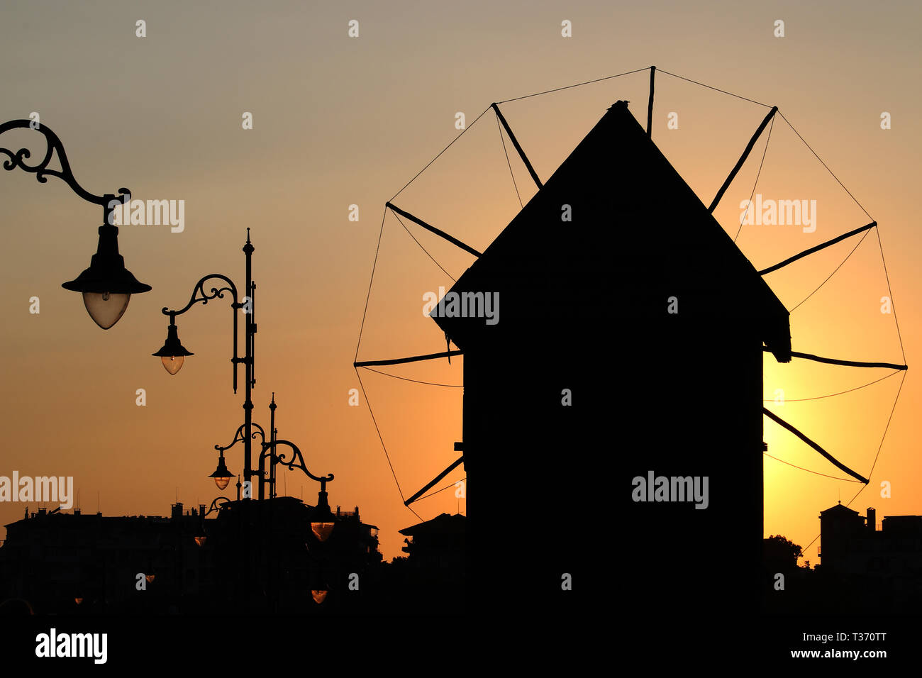 windmill silhouette sunset Nessebar Bulgaria summer season Stock Photo