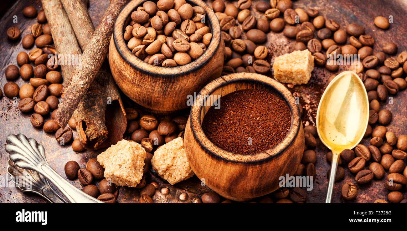 Roasted coffee beans and ground coffee.Dark roasted ground coffee Stock