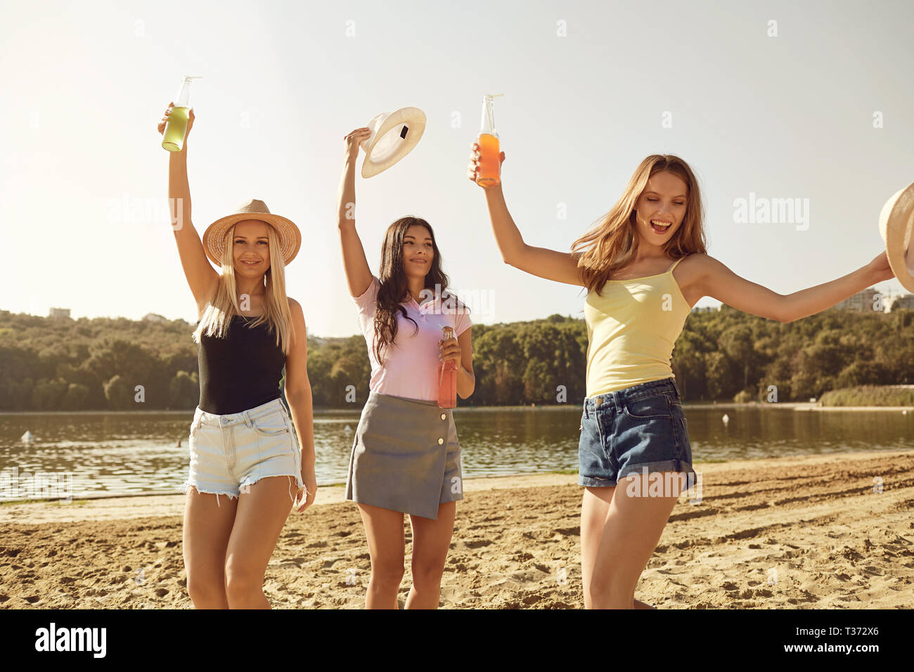 Girlfriends at a party on the beach in the summer ,autumn. Stock Photo