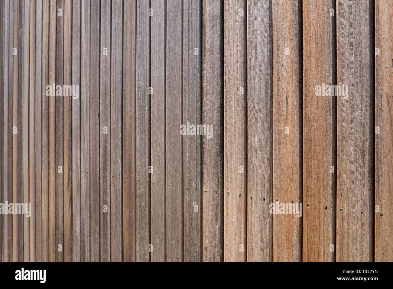 Weathered Wood Panel Texture Background Wall Cladding Made Of Aged Iroko Wood Planks Stock Photo Alamy