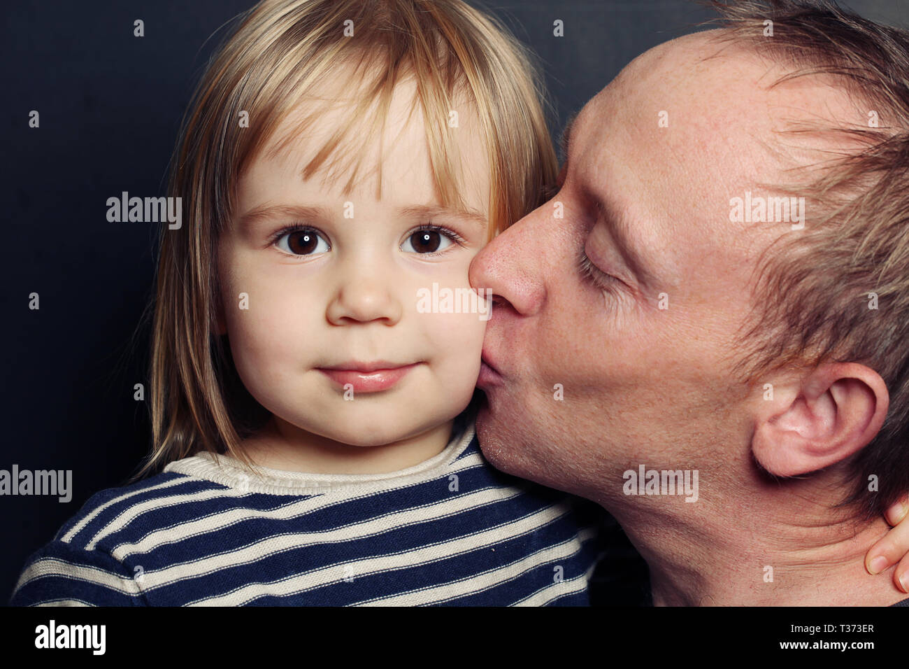 Adorable child and father. Dad kissing her baby, loving family Stock ...