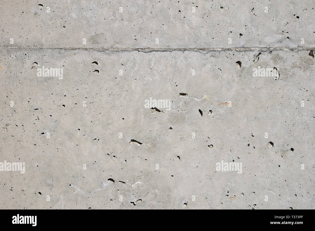 Grunge uneven grey concrete surface background texture Stock Photo