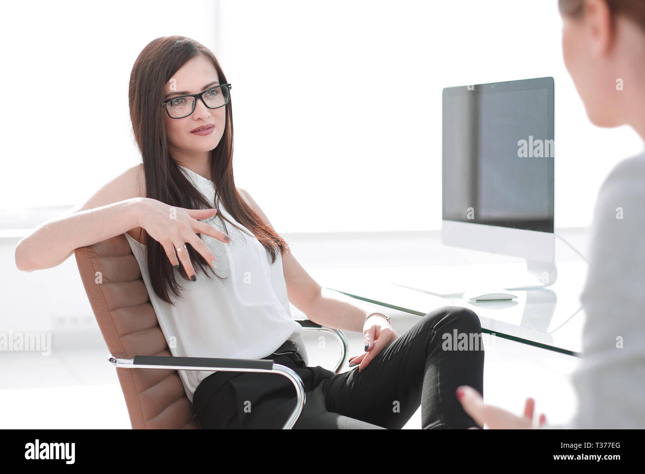 two business women are discussing the problem Stock Photo - Alamy