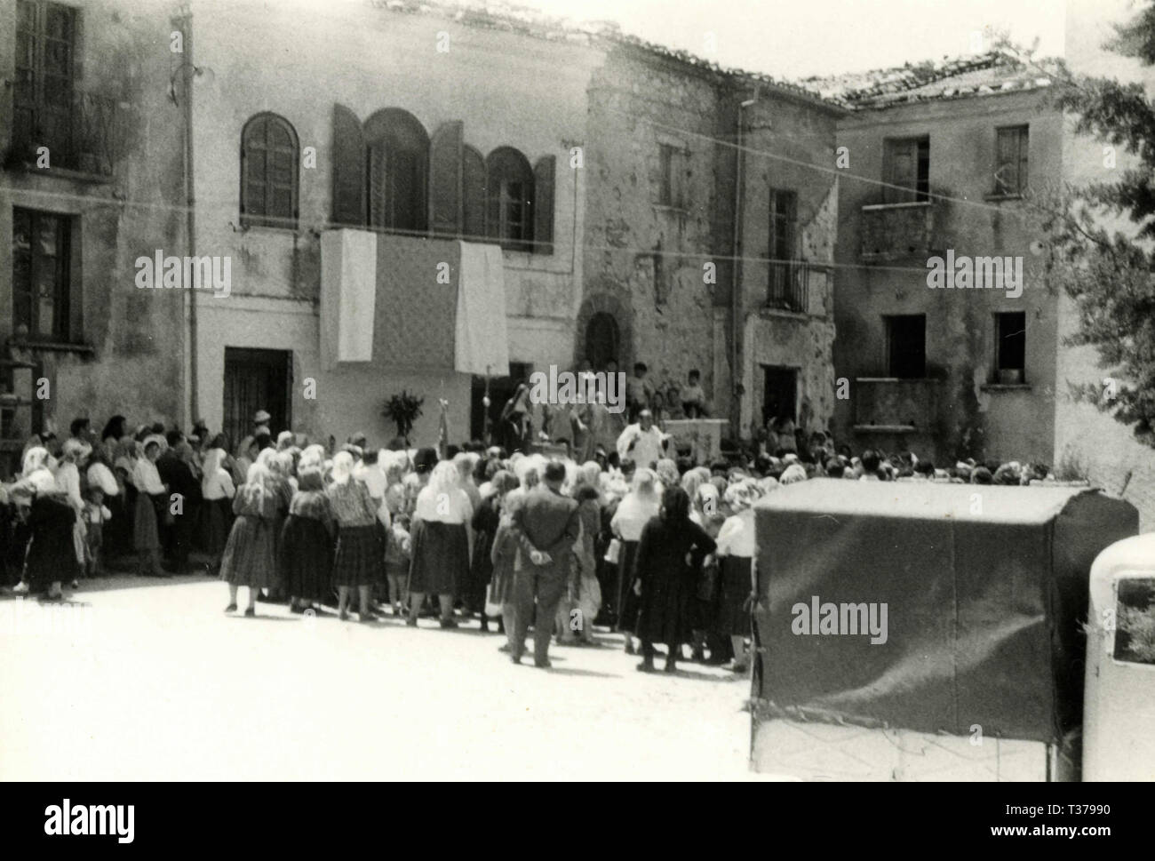 Mess in the open at the end of the procession in the village, Italy 1950s Stock Photo