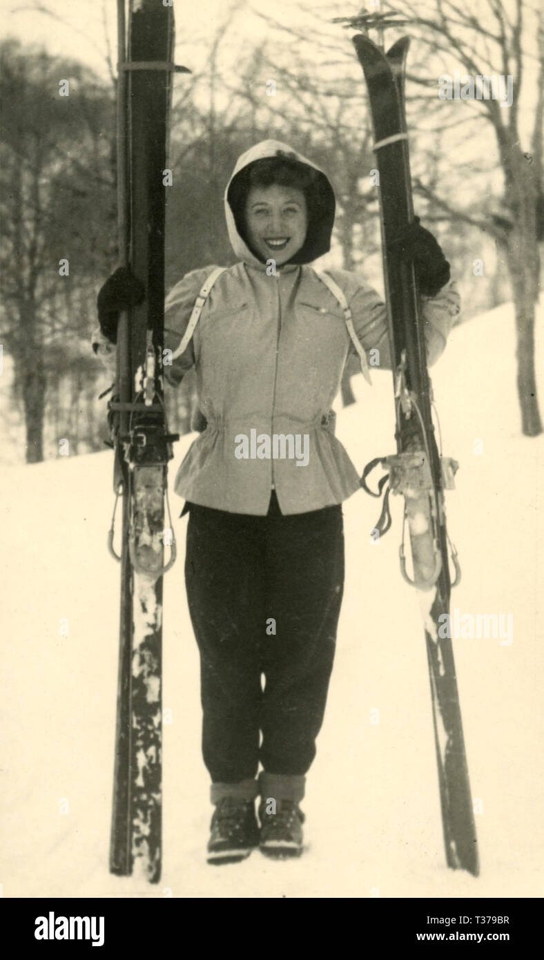 Woman skier during a pause, Italy 1960s Stock Photo