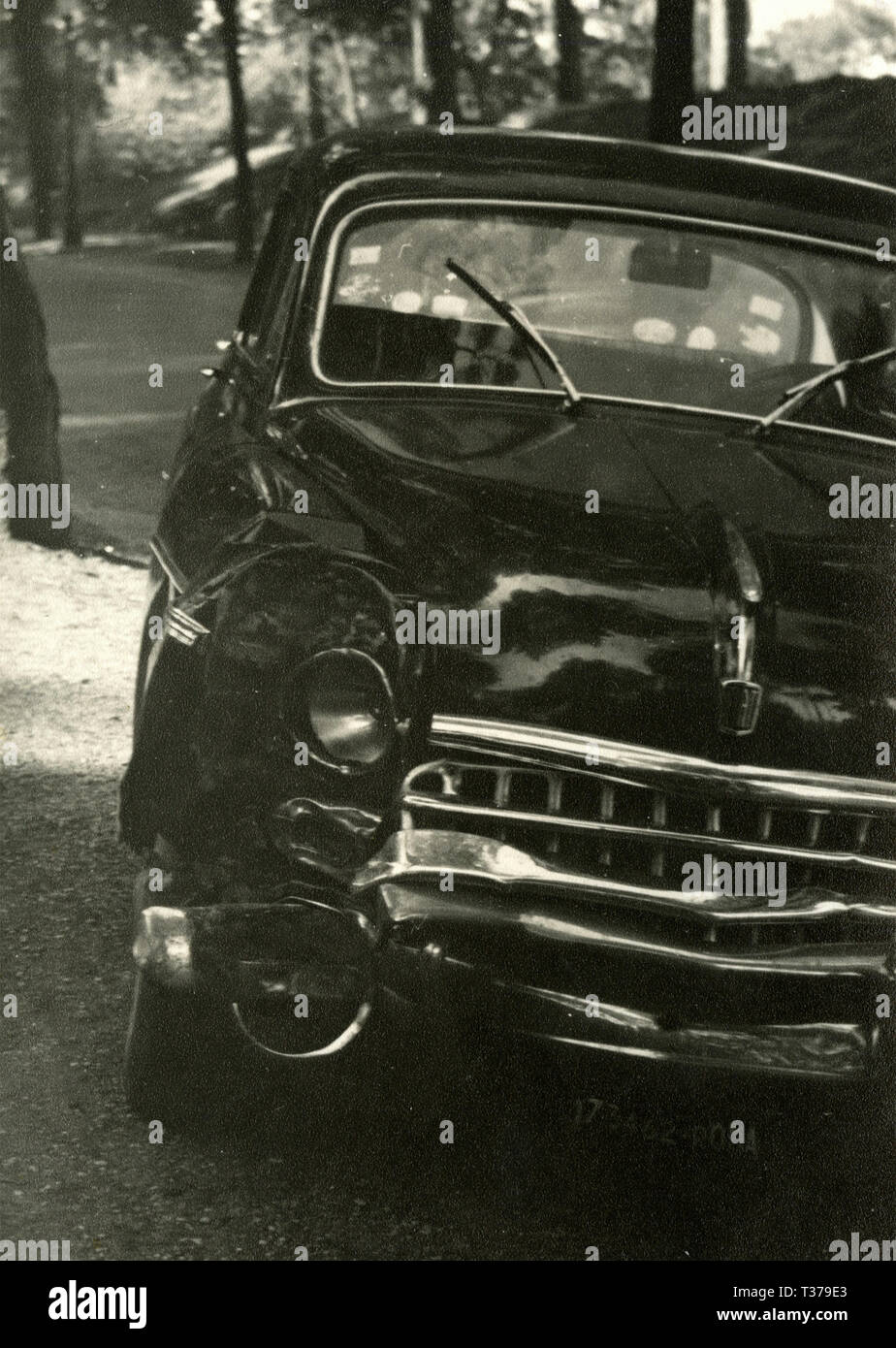 Ruined FIAT car, Italy 1960s Stock Photo