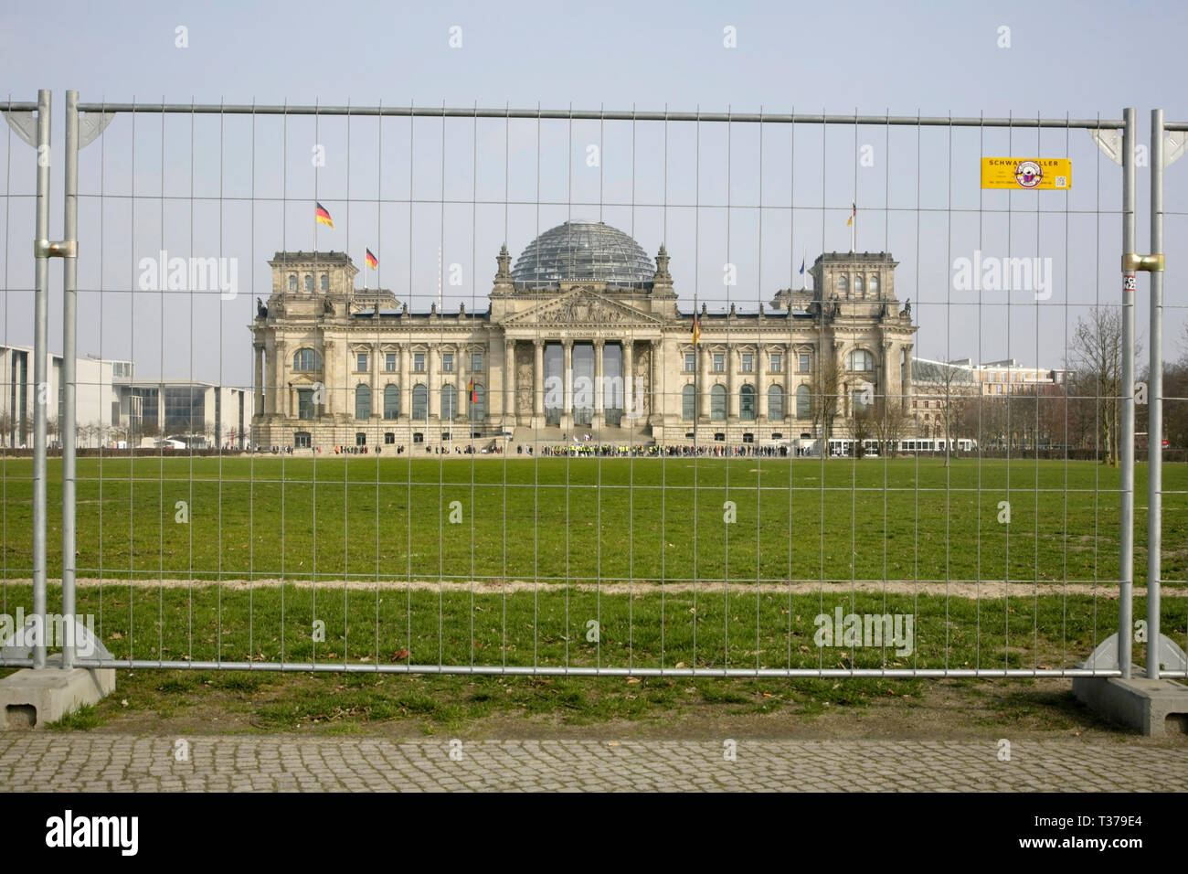 View of the Reichstag, Berlin, Germany through steel mesh fencing panel Stock Photo Alamy