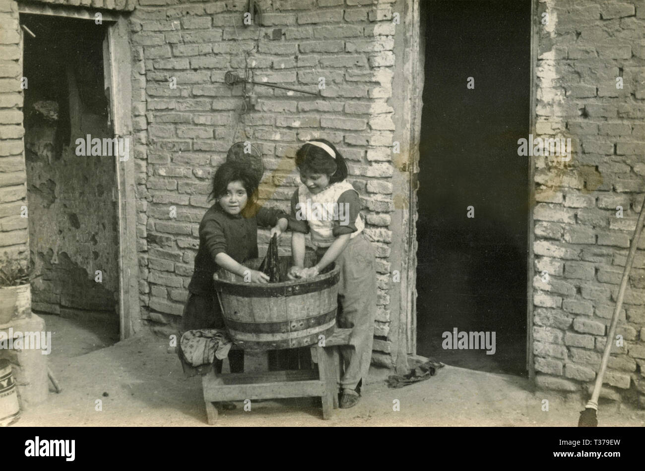 Children making laundry, Ponce, Porto Rico 1960s Stock Photo
