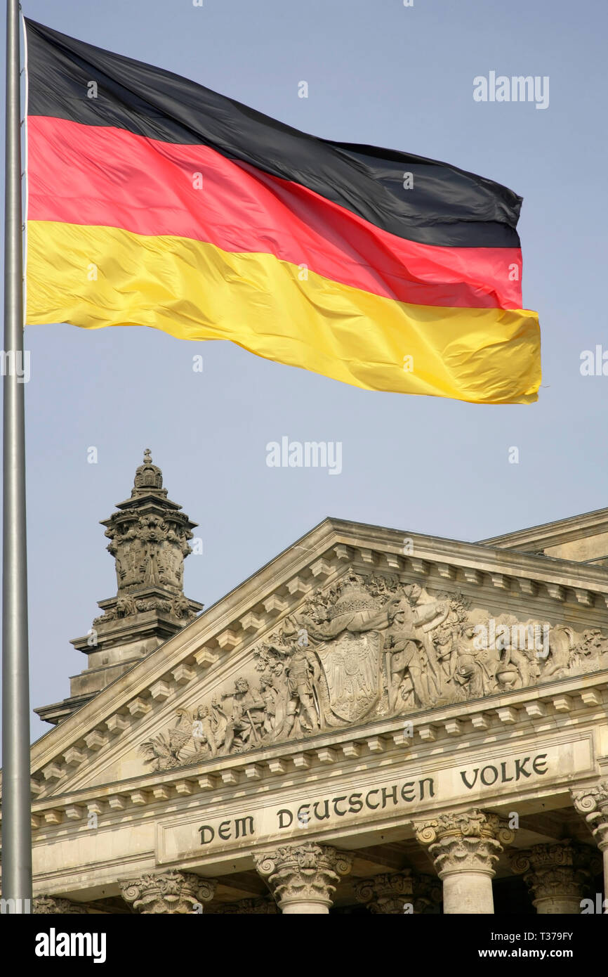 German national flag flying over the restored Reichstag, Berlin, Germany. Stock Photo